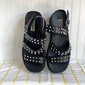 Steve Madden Black grommet, spike, and stud sandal. Size 8